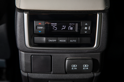 Rear HVAC controls. On the Touring trim I tested, that block-off plate housed a 120V electrical outlet.
